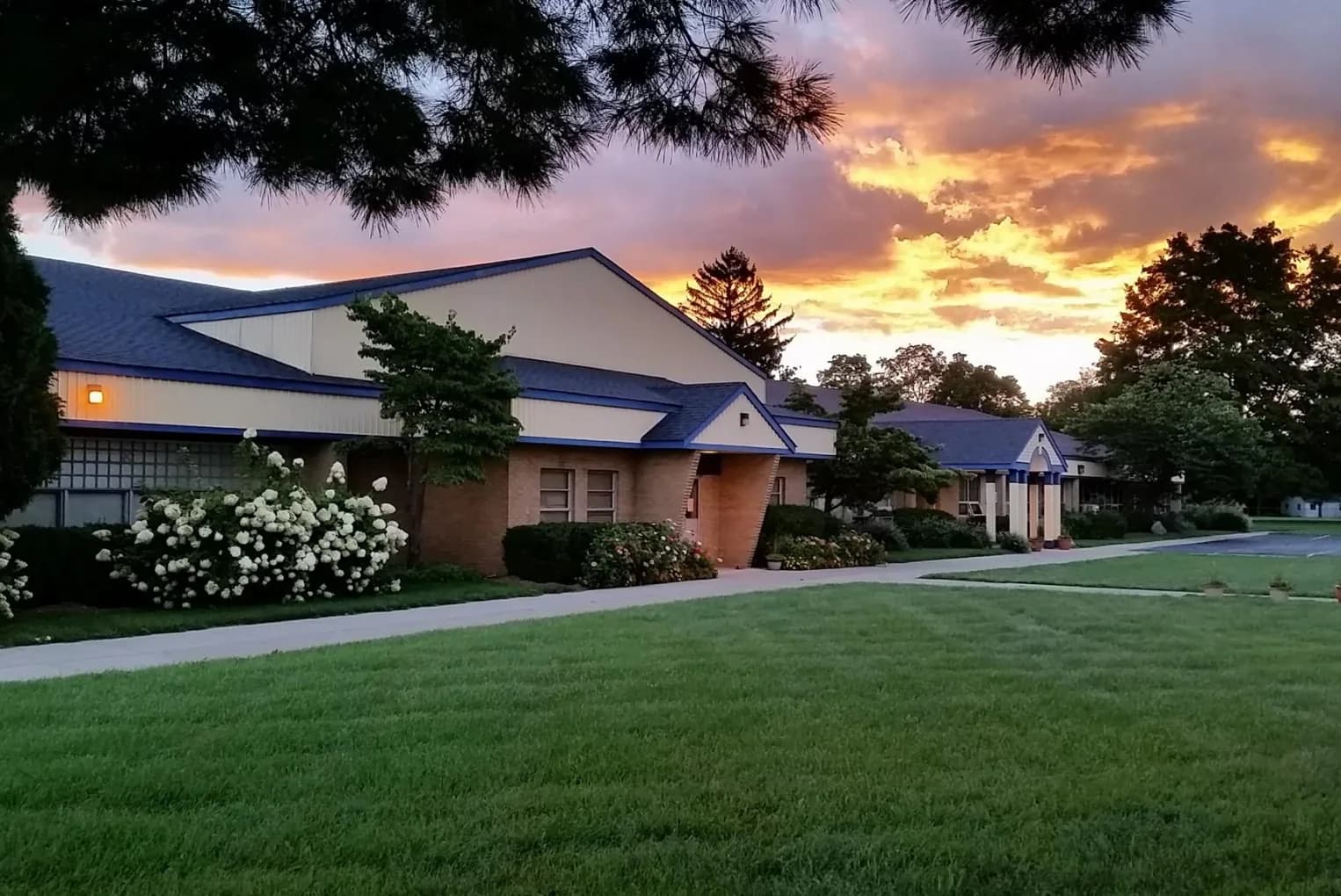 The Village school building at sunset